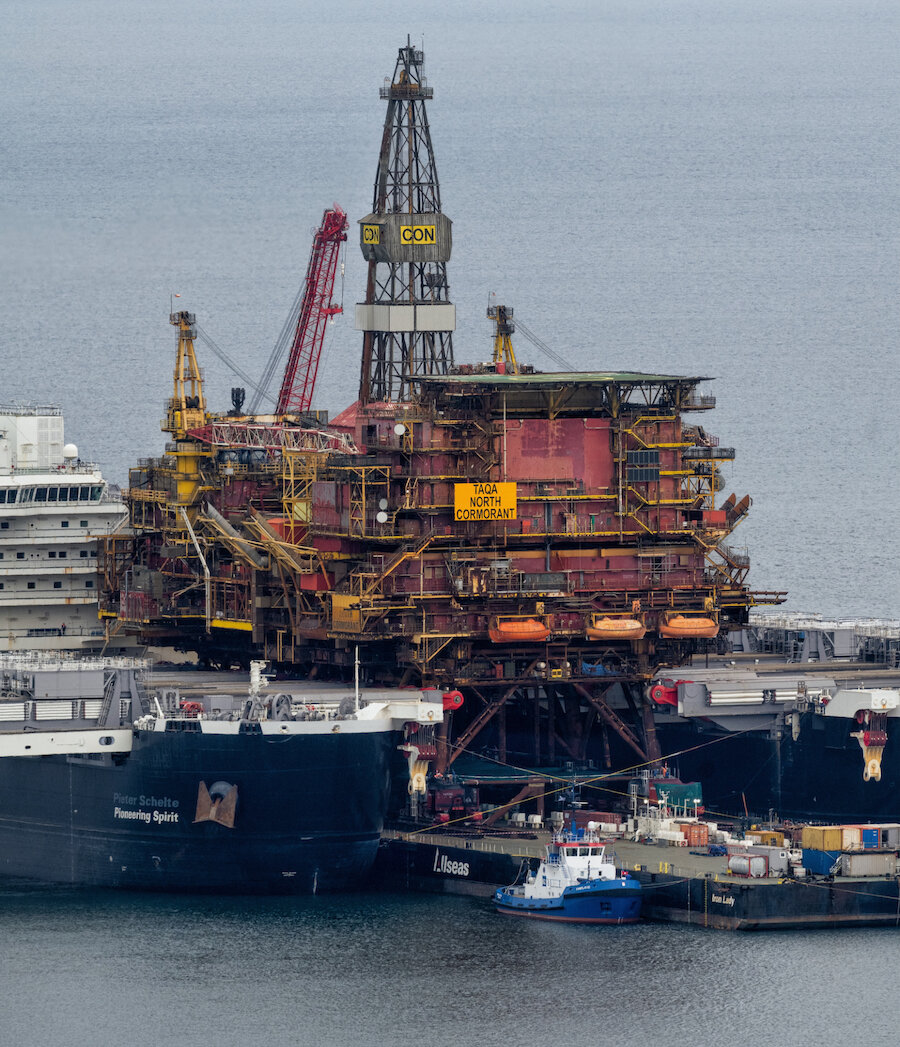 The North Cormorant oil platform arrives in Lerwick aboard the heavy lift ship Pioneering Spirit.