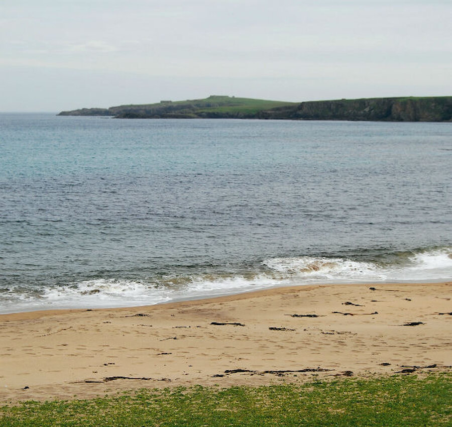 Lamba Ness is a long, low peninsula. It's seen here from the beautiful beach at Skaw (Courtesy Alastair Hamilton)