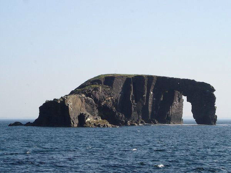 Dore Holm, with its natural arch, lies just off the coast (Courtesy Alastair Hamilton)