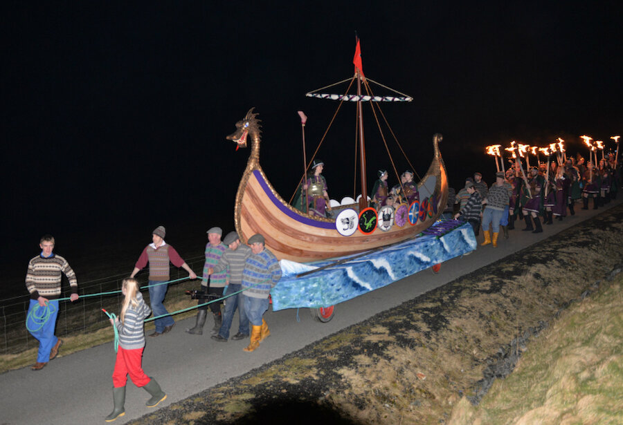 The South Mainland Up Helly Aa 2015: Shetland's first female Guizer Jarl leads the procession to the spectacular burning site at St Ninian's Ayre. Such events may be taken as evidence of the strength of a community, one of the things which the Place Standard tries to assess. (Courtesy Alastair Hamilton)