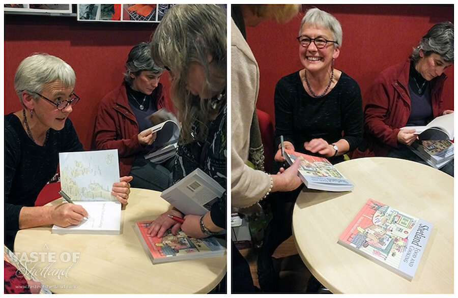 Marian signs her books for a queue of people