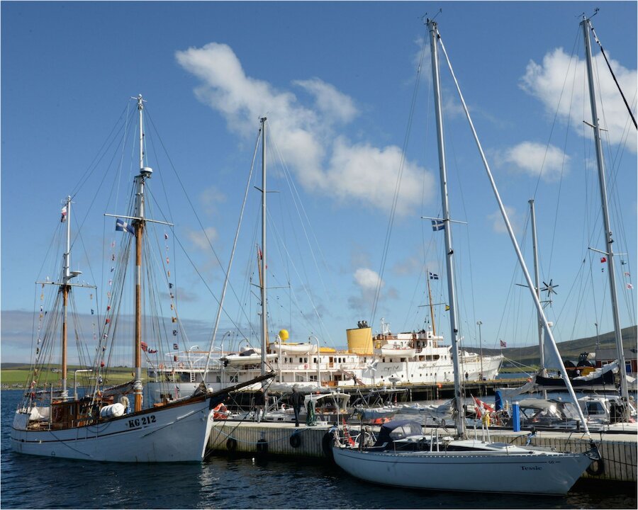 A graceful ship, the Norwegian royal yacht joined much smaller visiting vessels in Lerwick.
