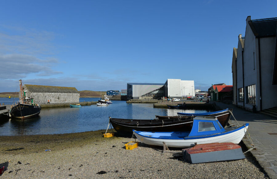 The revitalised waterfront: alongside the old Hay's Dock is the new Shetland Museum and Archives. Farther away is the bold form of Mareel, the arts centre, and beyond it some of the new offices on the business park.