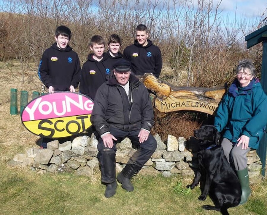 Ray and Betty Ferrie with the Shetland Youth Legacy Ambassadors at Michaelswood. (Courtesy Shetland islands Council)