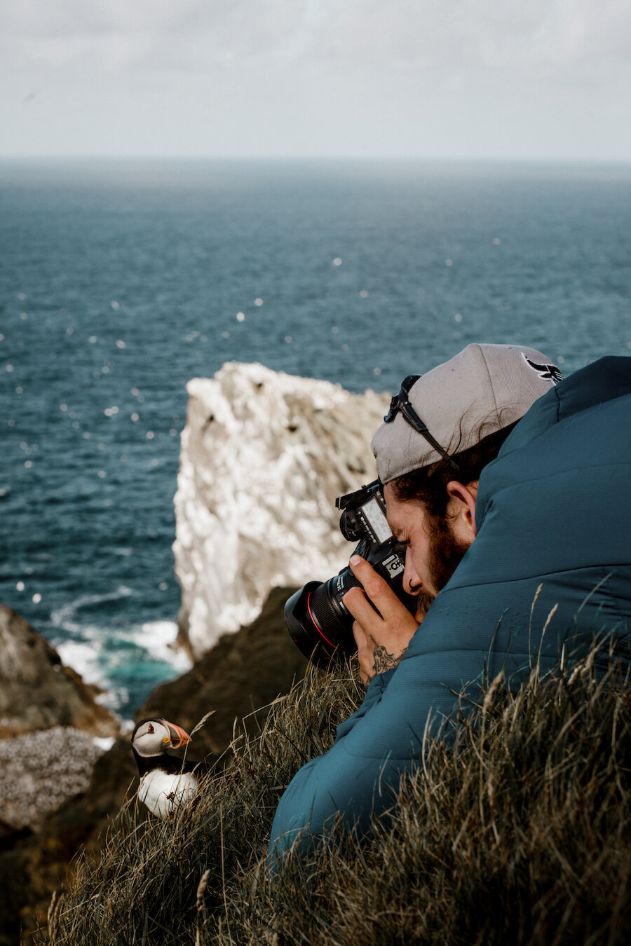 Ritchie Williams photographing a puffin at Hermaness | Susan Molloy