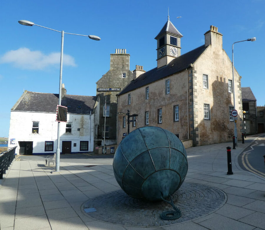 The Tolbooth and, in the foreground, Da Lightsome Buoy (Coutesy Alastair Hamilton)