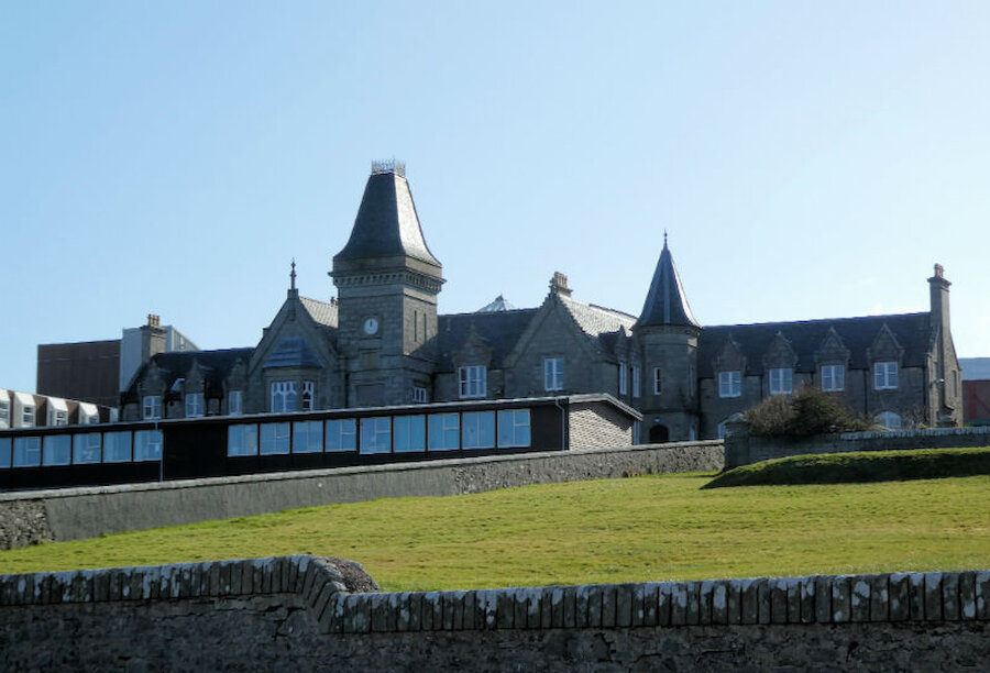 The French-influenced architecture of the original Anderson Educational Institute, for the time being partly hidden behind temporary classrooms (Courtesy Alastair Hamilton)