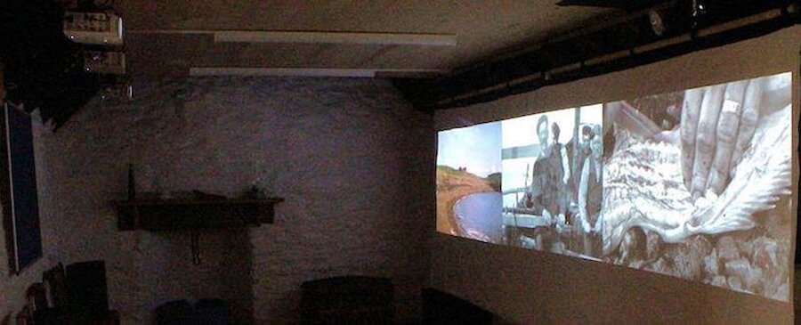 The presentation uses three projectors and a very large screen. | Jo Millett