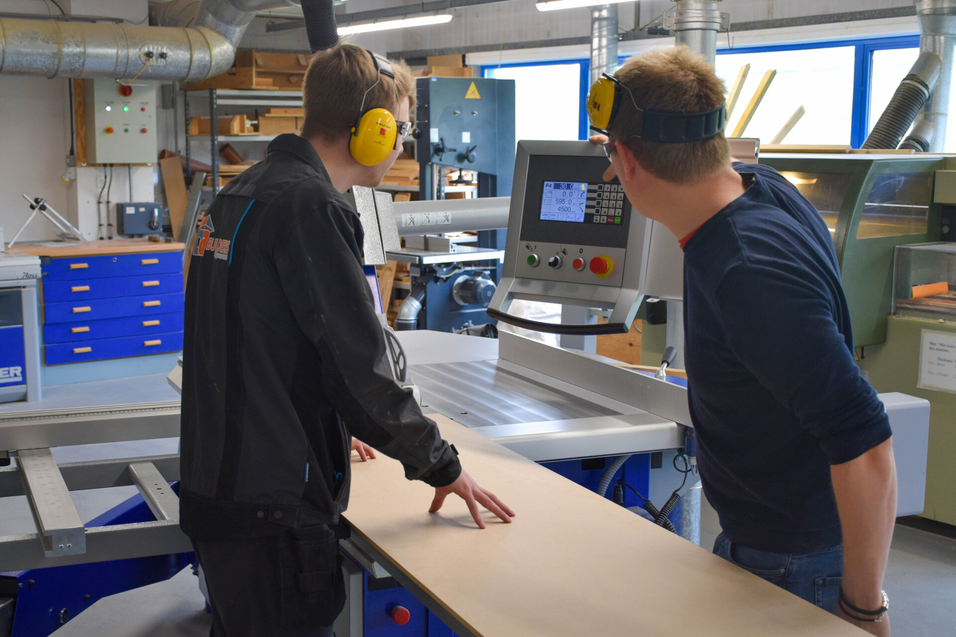 Construction lecturer David White (right) with Carpentry & Joinery Apprentice James Knight. The machine they are using is a sliding table panel saw (Felder Format 4 Kappa 400 x-motion).