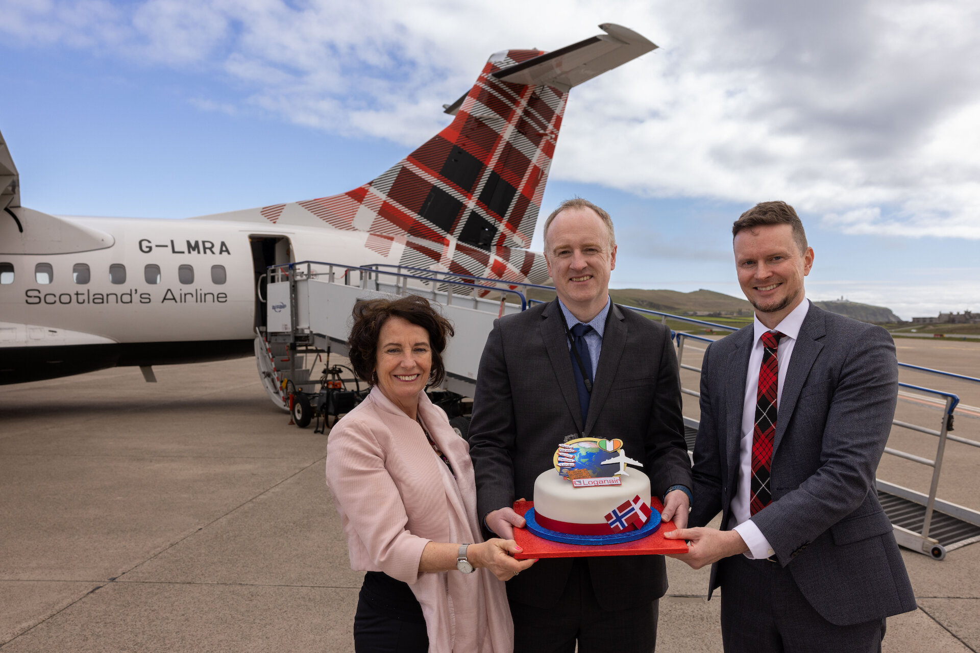 Business link: Liz Henderson from London Chamber of Commerce celebrates the new connection from London Heathrow to Sumburgh with Promote Shetland manager David Nicol (centre) and Loganair's chief commercial officer Luke Lovegrove. | Loganair