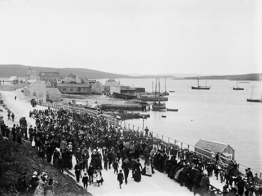 The Golden Jubilee parade marching towards Lerwick's Market Cross back in 1887. Image courtesy of Shetland Museum and Archives.