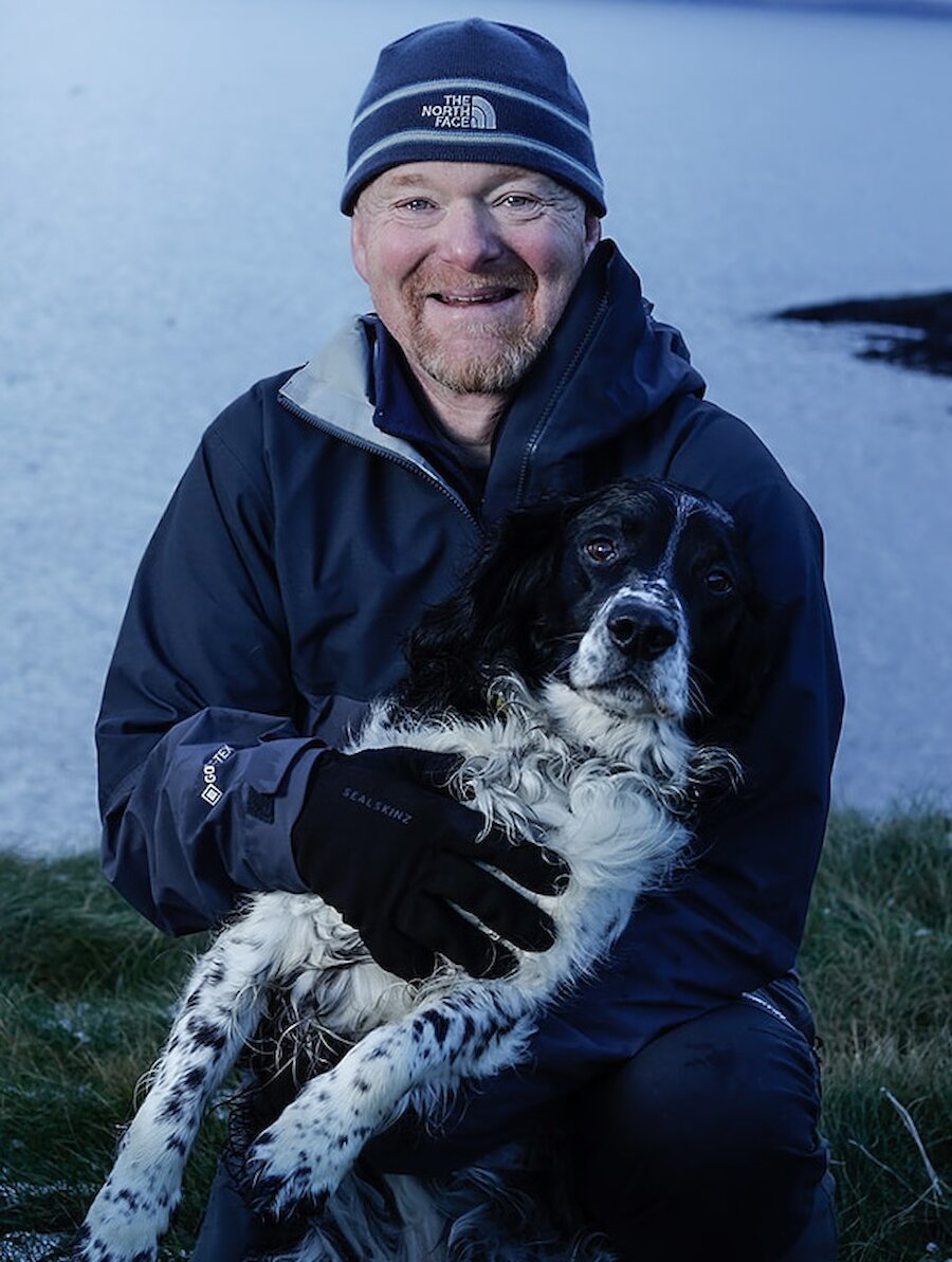 Ryan Leith, with his beloved dog Murray, photographed for Promote Shetland by May Graham.