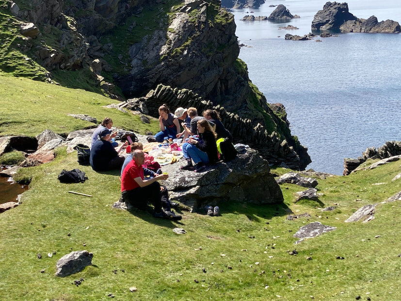 Enjoying a picnic overlooking the cliffs at Tonga Stack in Unst. | Courtesy of Cheryl Jamieson
