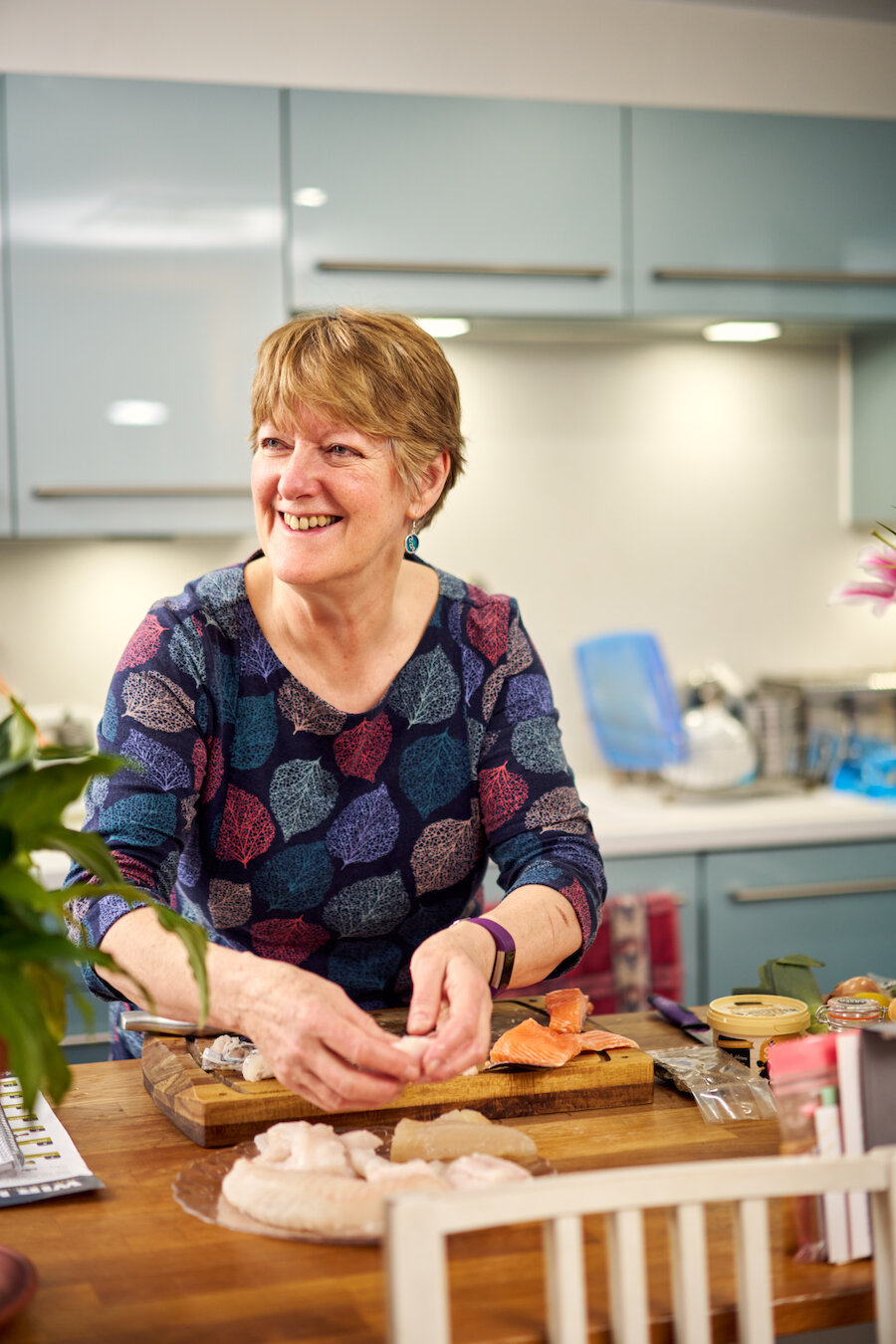 Mary Andreas preparing a Shetland seafood stew in her home kitchen. Photo: Euan Myles / Promote Shetland.