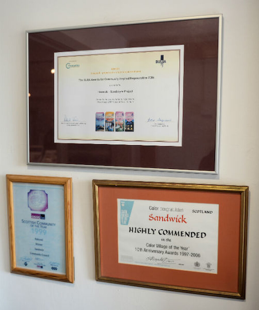Some of the awards that Sandwick's community has won (Courtesy Alastair Hamilton)