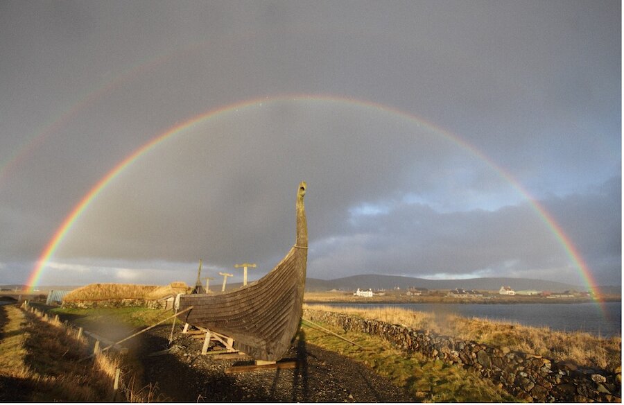 Shetland is one of the best places in Europe to see rainbows. This one arches over the replica Viking longboat 'Skibladner' at Haroldswick, Unst.