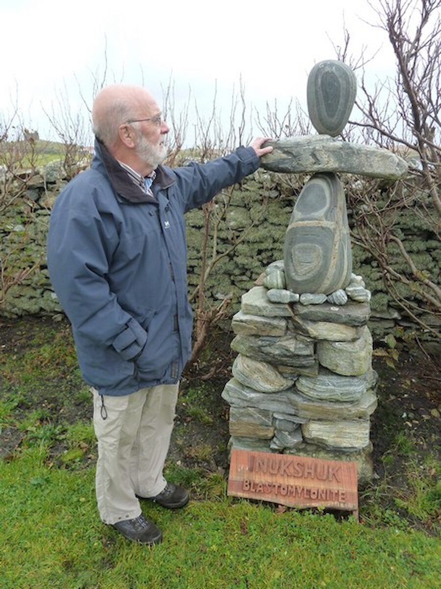 Mike McDonnell with one of the stone figures at Burravoe's Old Haa Museum | Jennifer McDonnell