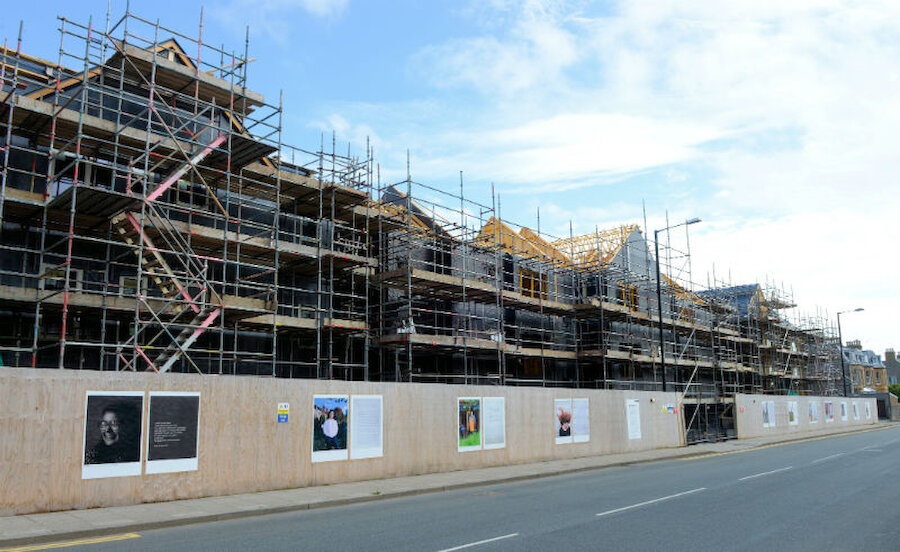 Hoardings around a new development of flats are the site of the exhibition (Courtesy Alastair Hamilton)