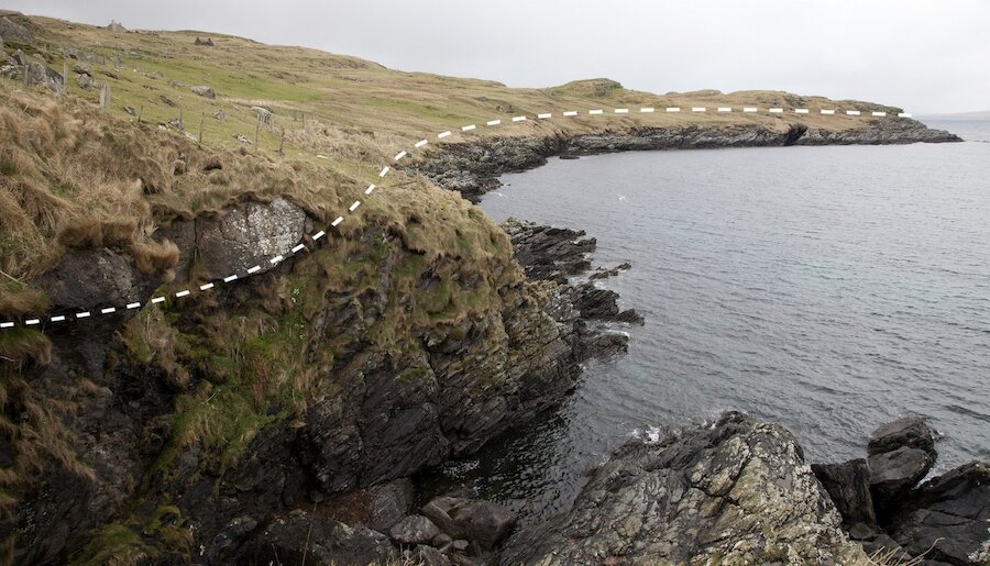 Image showing the line of the nonconformity, with Dalradian phyllites below and Devonian sandstones above