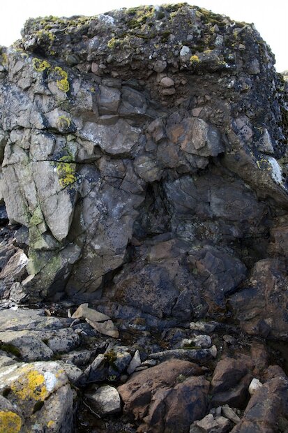 Breccia in the foreground at Muckle Hell vent with sandstone slabs beyond