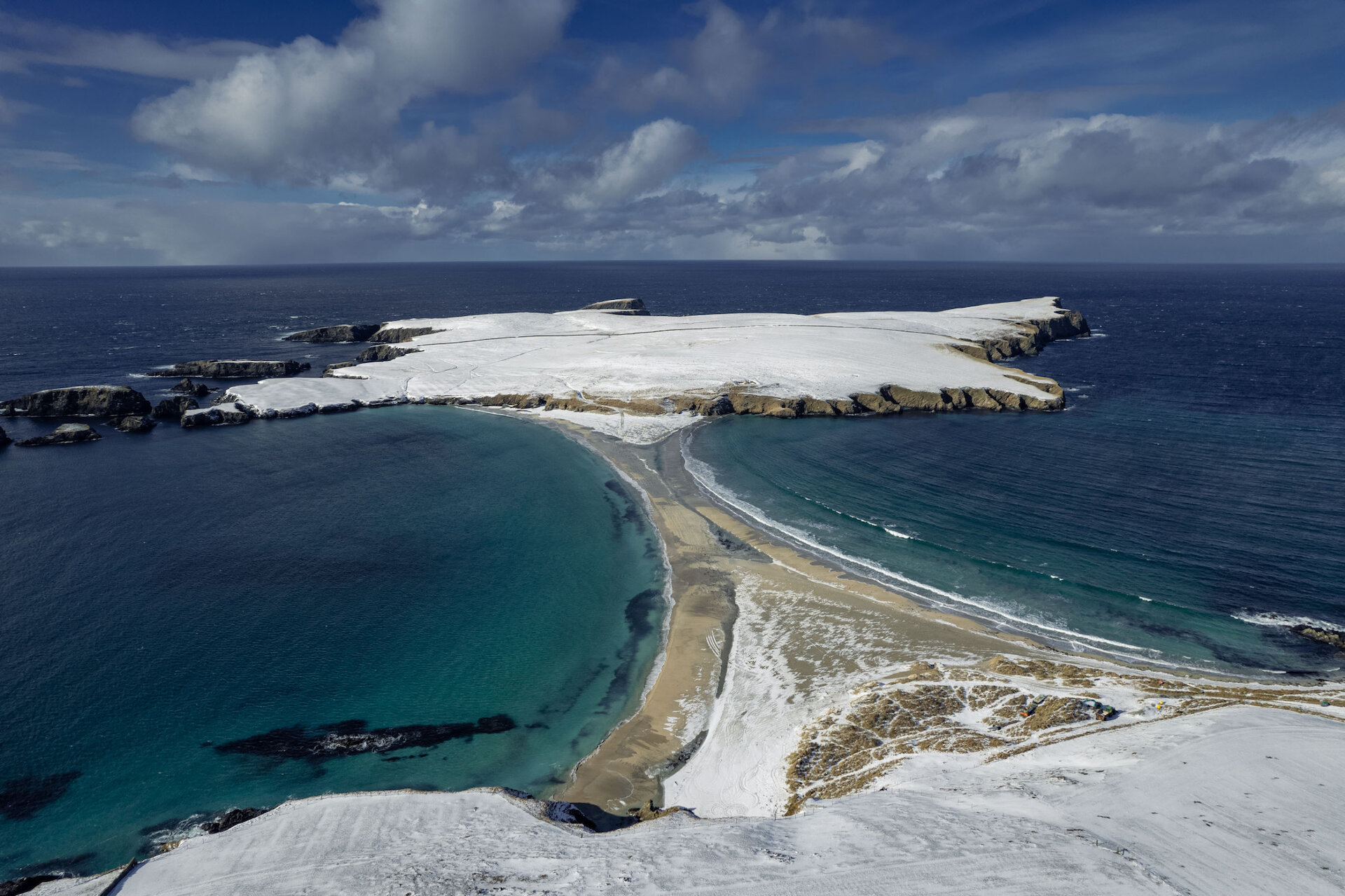 The spectacular tombolo, linking St Ninian's Isle to Mainland, covered with a dusting of snow.