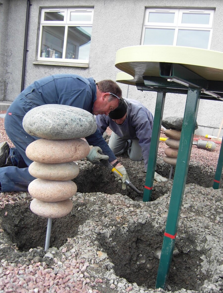 Installing the Geopark Shetland table exhibit at Braewick Café, Eshaness.