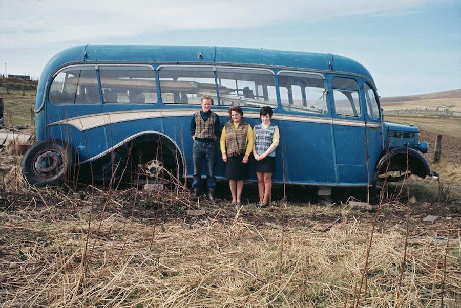 Charlie Clarke, Willa Mary Laurenson and Mina Laurenson in front of derelict 1947 Bedford bus, Baltasound, June 1970 | Photo by Chris Morphet/Redferns/Getty Images