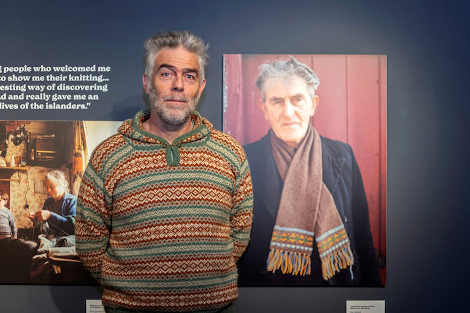 Christopher Ritch beside the portrait of grandfather Jeemie Ritch | Alexa Fitzgibbon