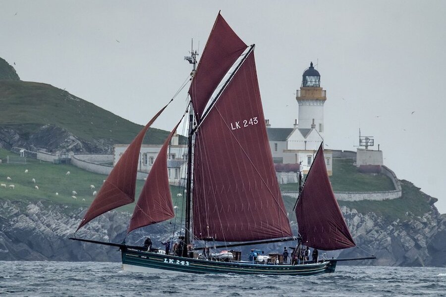 'Swan' in full sail passes the Bressay Lighthouse | Maurice Henderson/Swan Trust