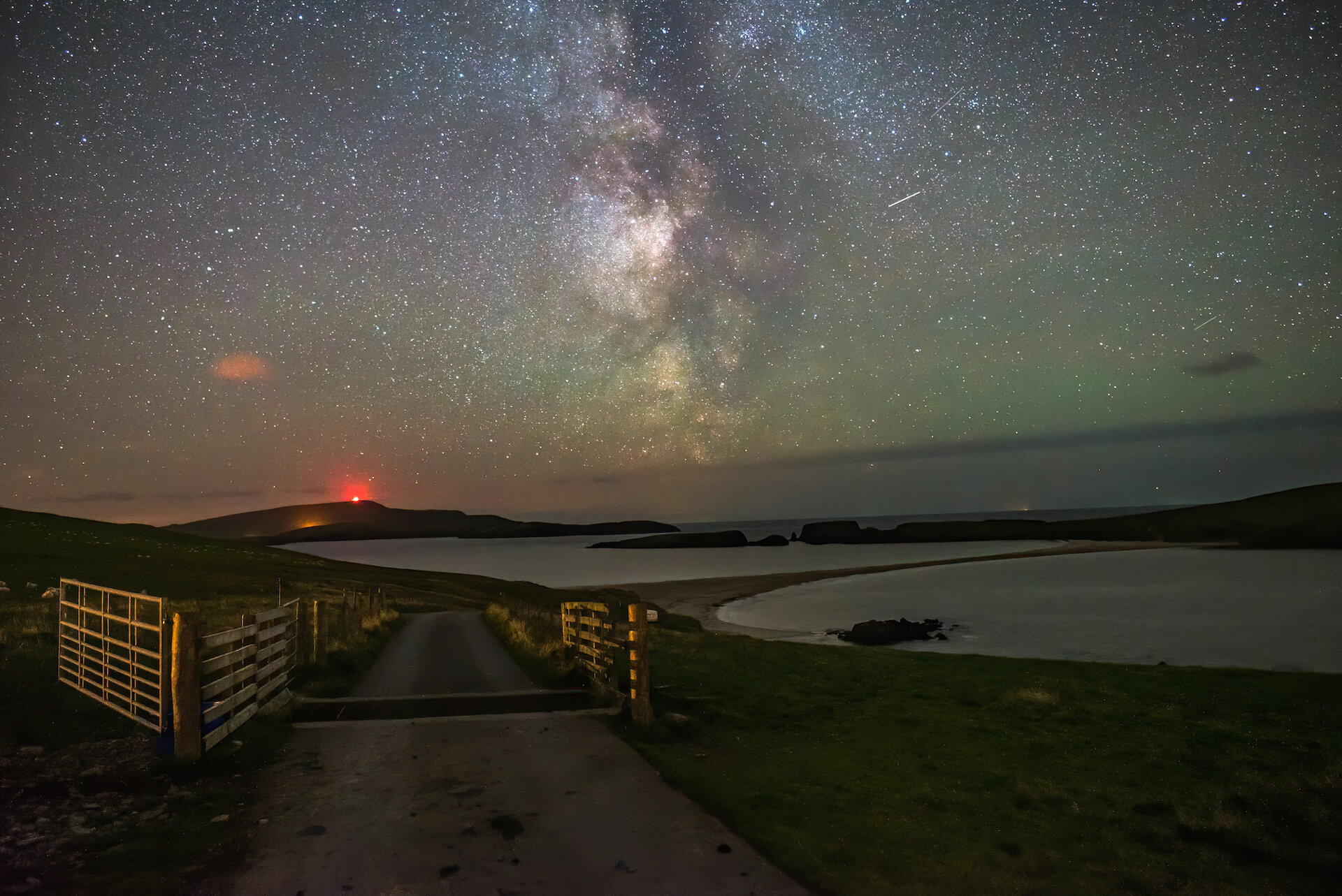 The Milky Way photographed from Bigton, with the tombolo St Ninian's Beach visible.