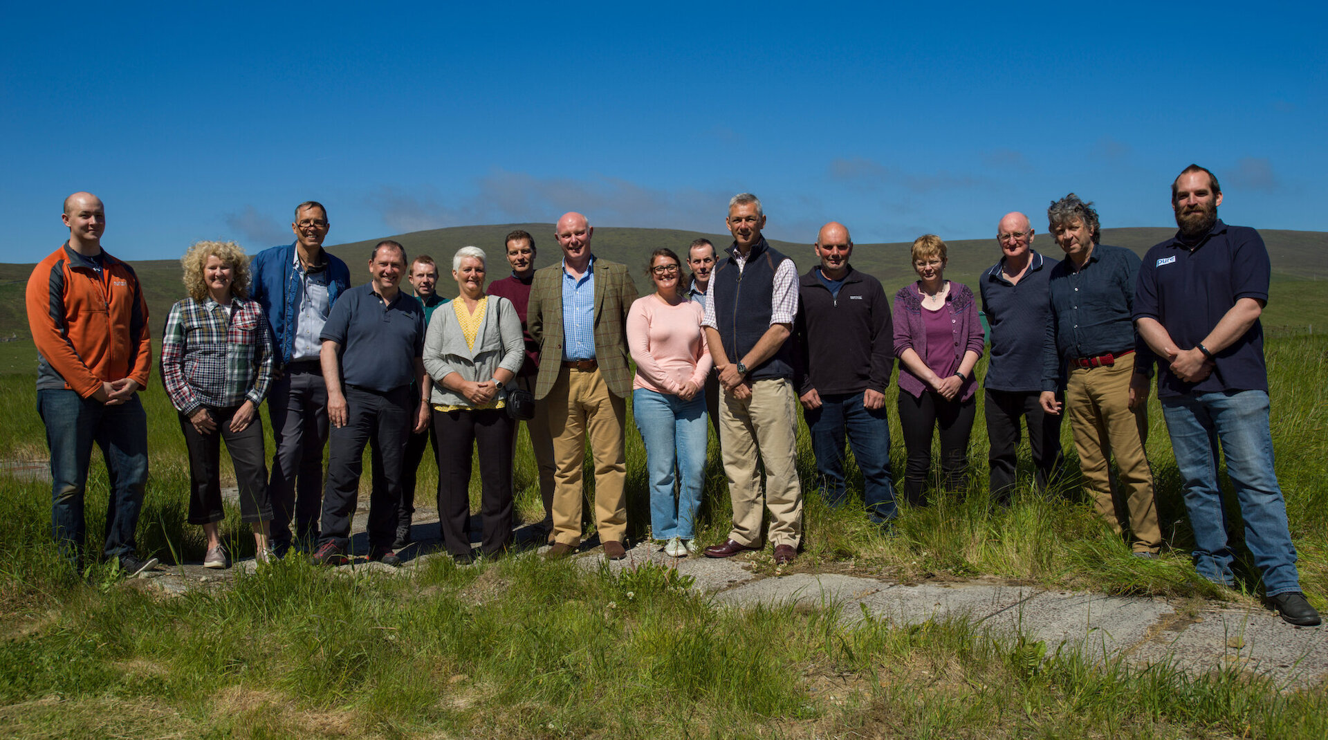 An earlier delegation from UKSA and the MoD with the SaxaVord Spaceport team, including the late Frank Strang, and members of the local community.