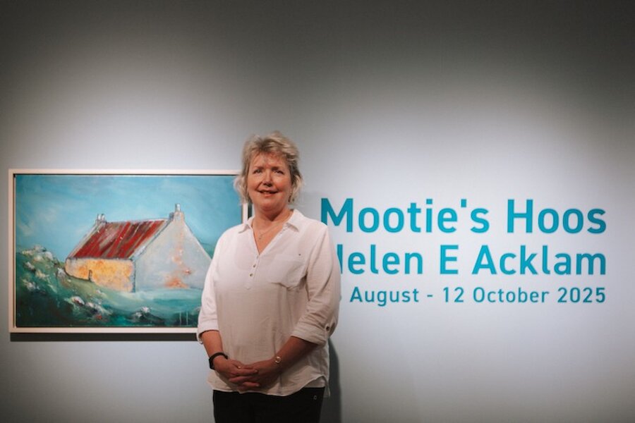 Helen Acklam at the entrance to the exhibition.