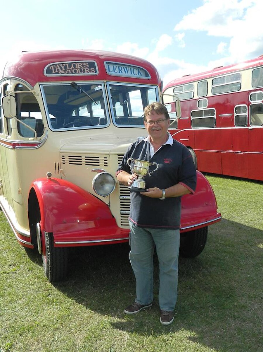 Nick Taylor with the restored coach (Courtesy Shetland Coach Trip)