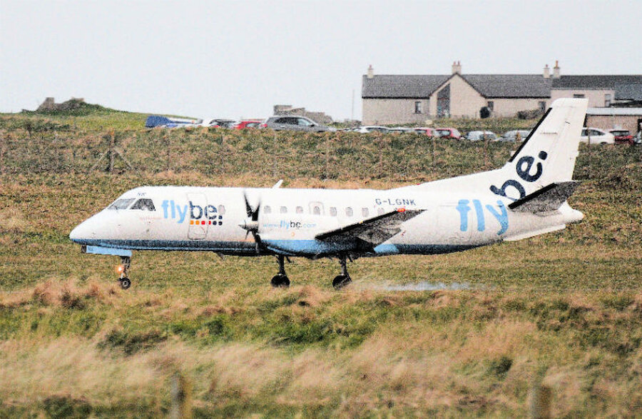A Loganair Saab 340B, in Flybe colours, touches down at Sumburgh on arrival from Aberdeen. Loganair will use its own livery from 1 September. (Courtesy Alastair Hamilton)