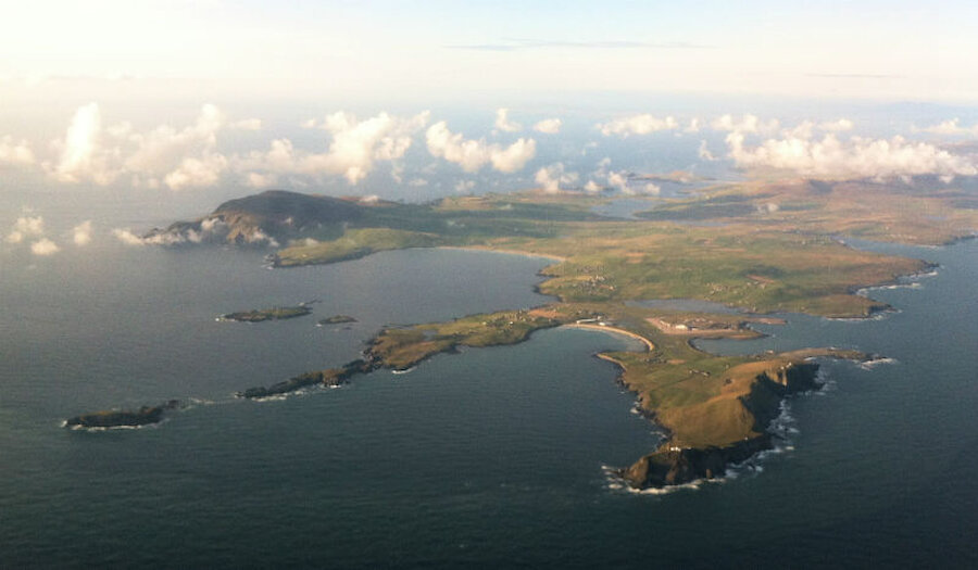 Sumburgh Airport seen after take-off. Sumburgh Head, with the airport just beyond, is in the right foreground. Fitful Head is at centre left. (Courtesy Alastair Hamilton)