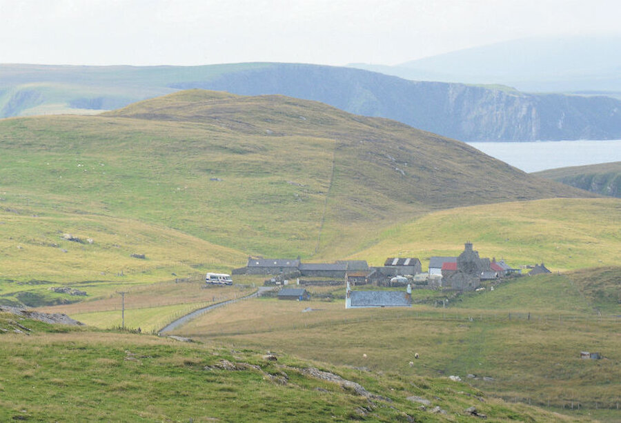 A bus waits to begin its journey at the hamlet of Houss, Burra Isle, which has four services to Lerwick each day (Courtesy Alastair Hamilton)