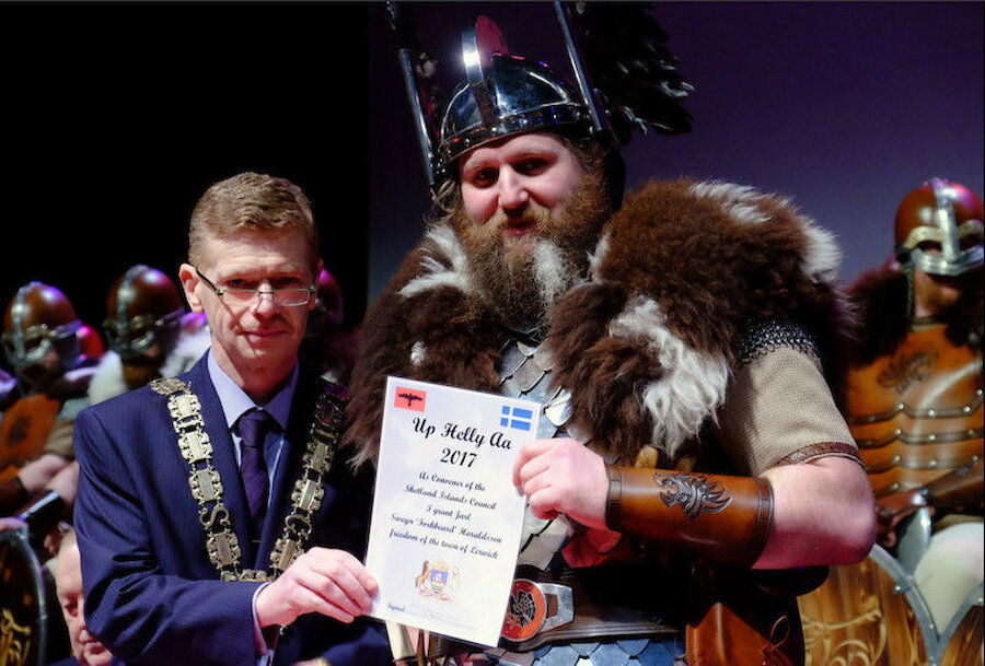 Guizer Jarl Lyall Gair receives the freedom of Lerwick from Shetland Islands Council Convener Malcolm Bell (Courtesy Shetland Islands Council)