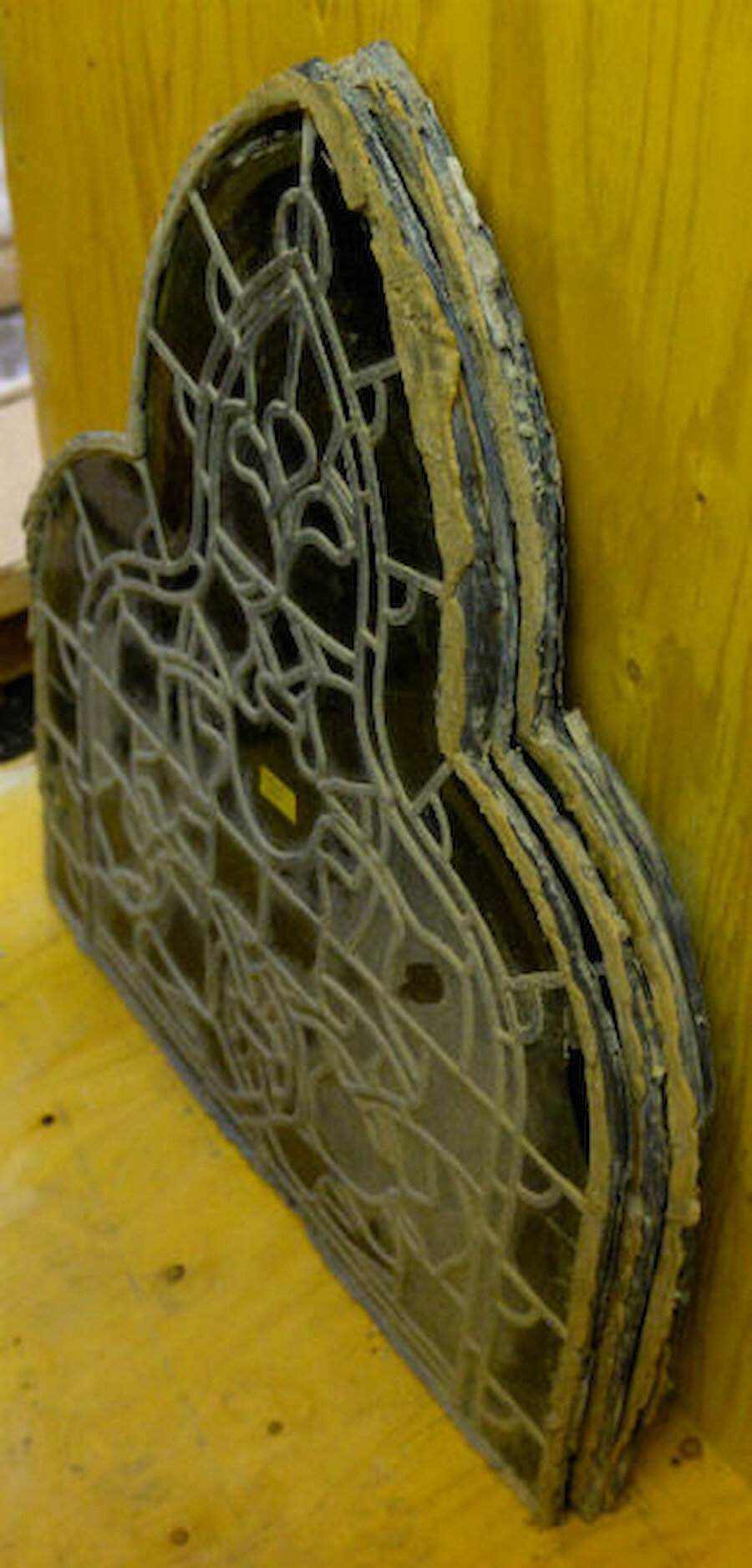 Sections of stained glass awaiting restoration. Again, the butyl rubber sealant can be seen adhering to the lead. (Courtesy Alastair Hamilton)